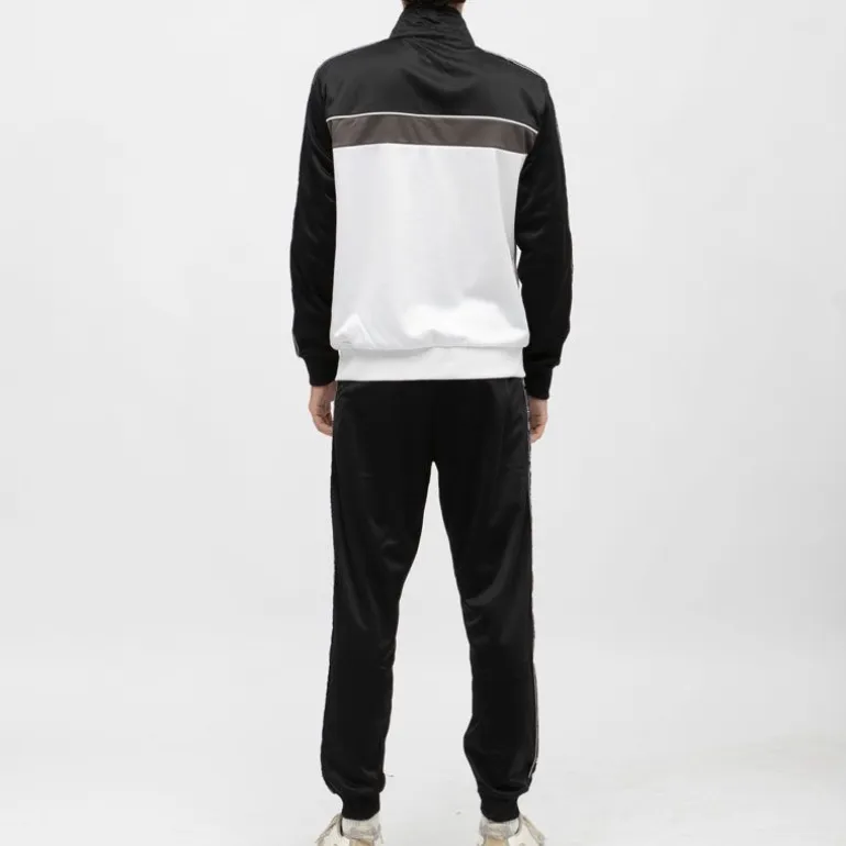 Ensemble jogging noir et veste zippée blanche avec bandes noires Homme ELLESSE